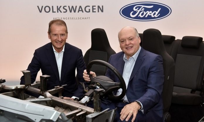 Volkswagen CEO Herbert Diess and Ford President and CEO Jim Hackett appear in a prototype vehicle after announcing a joint investment in Argo, a self-driving autonomous vehicle company in New York City